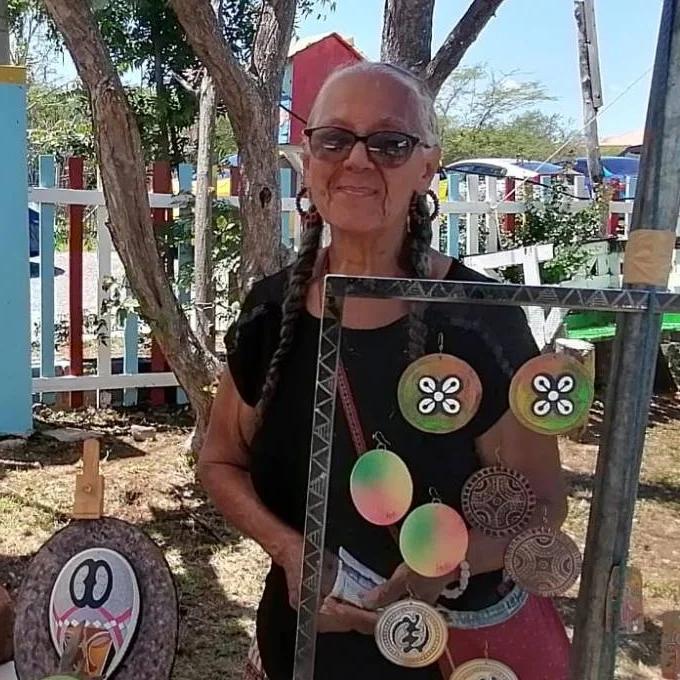 At the Imani Collect stall, beside a frame of painted earrings