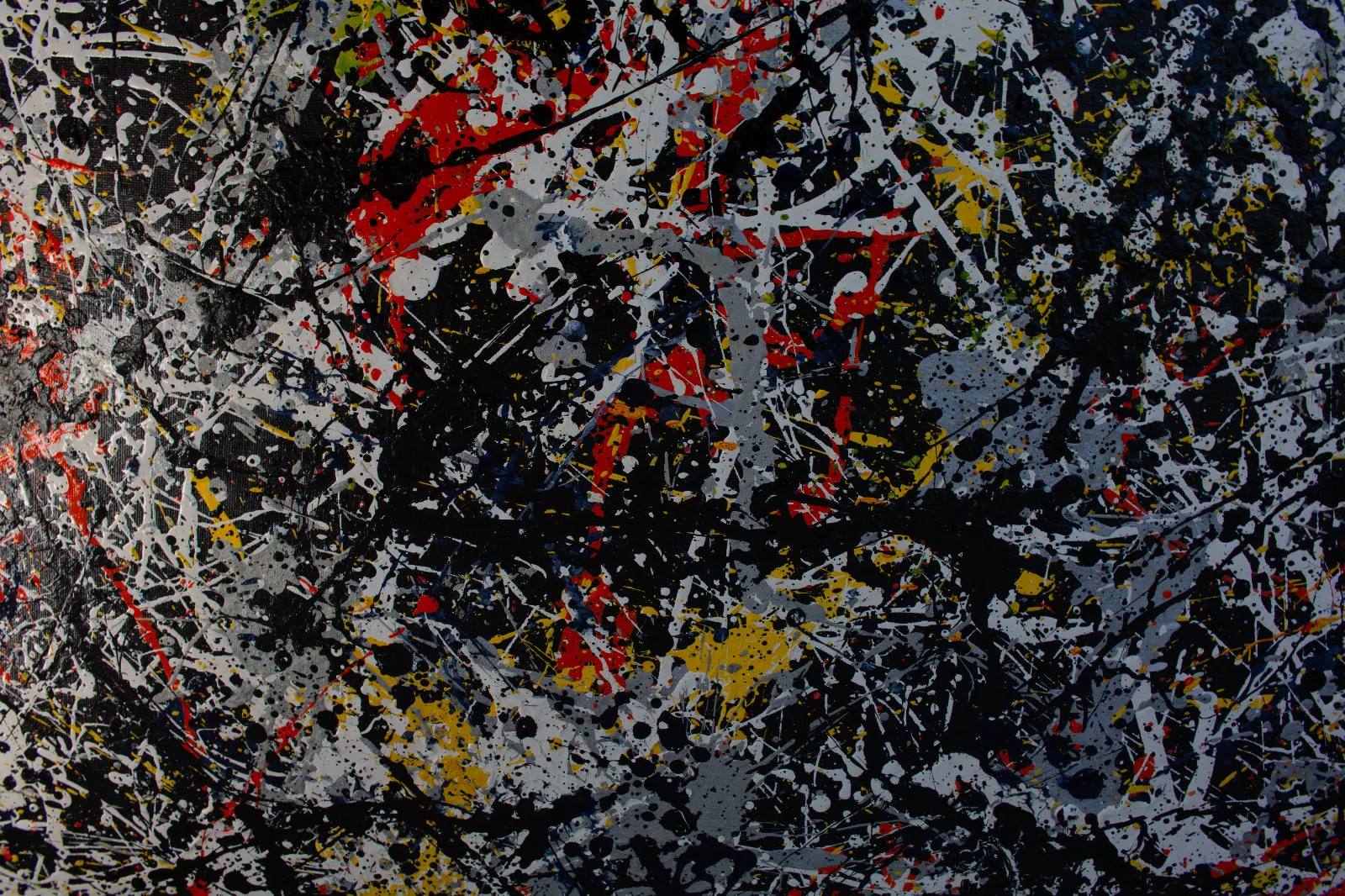 A drip painting in black, white, grey, red and yellow