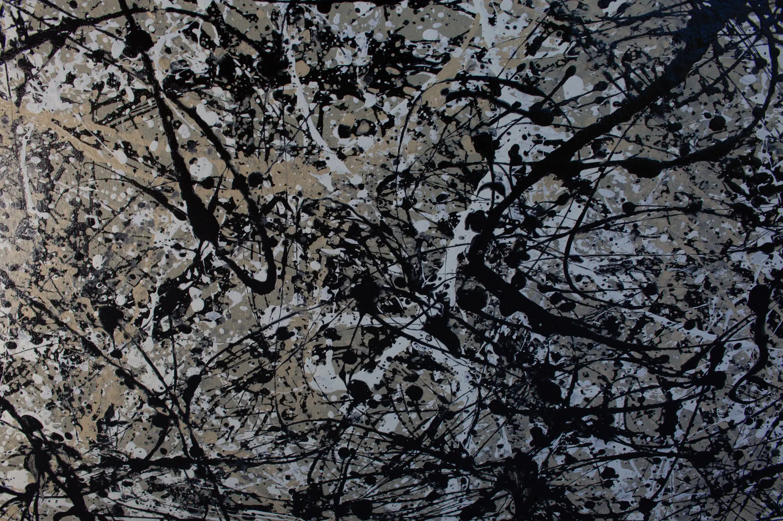 A drip painting in black, white and grey