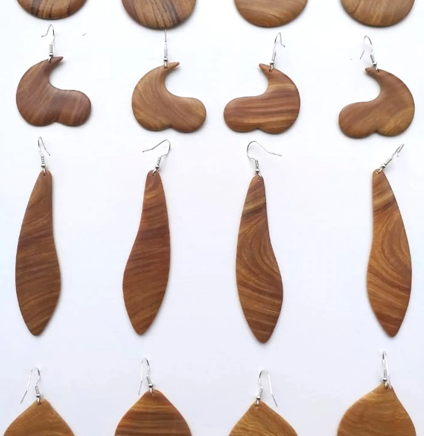 Wooden earrings in leaf, wave and round shapes