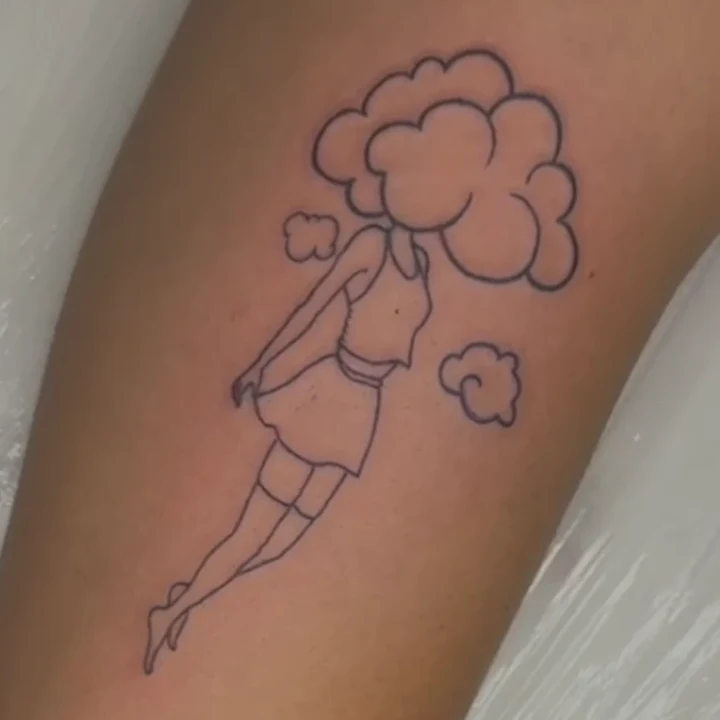 A line tattoo of a figure with a cloud for a head