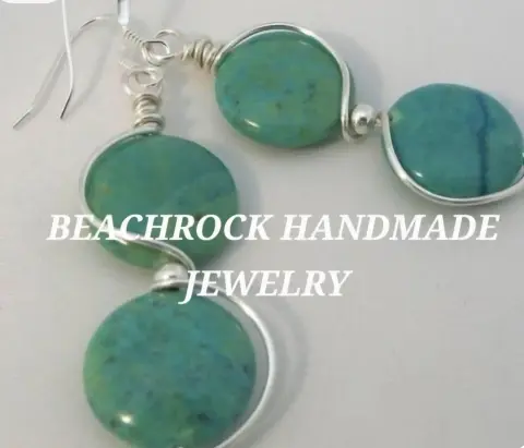 Silver wire earrings, each holding two round turquoise-green stone beads, with the words Beachrock Handmade Jewelry across the photo