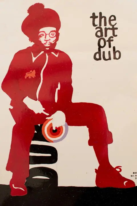“The Art of Dub”: a figure in red with a dub plate, signed Dennis Di Artist