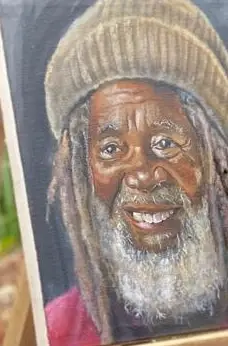 A painted portrait of a smiling elder with a white beard and a knitted cap