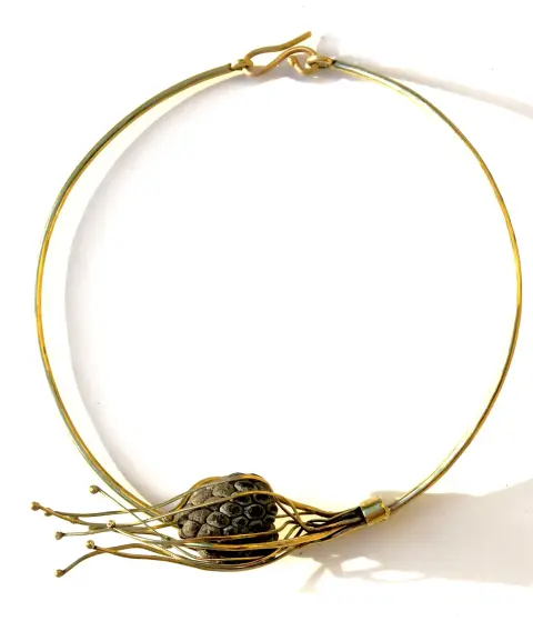 “Breeze”: a brass choker with a seed pod wrapped in fine brass wires